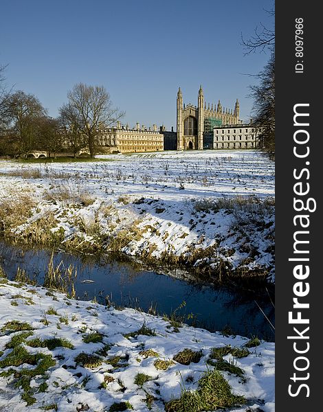 Kings College Chapel Cambridge in the winter bathed in sunlight with snow on the ground. Kings College Chapel Cambridge in the winter bathed in sunlight with snow on the ground