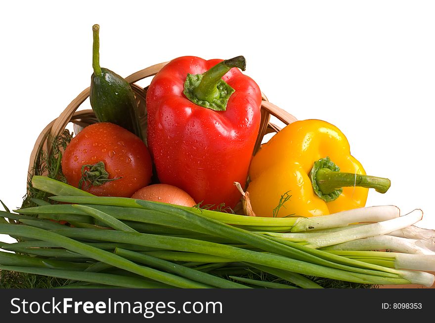 Vegetables in a basket it is isolated on a white background. Vegetables in a basket it is isolated on a white background.