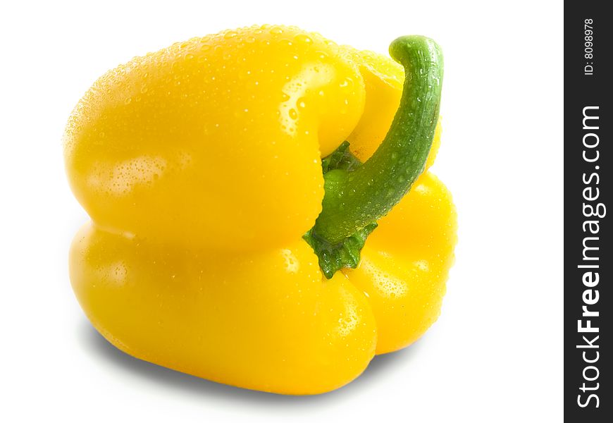 Yellow pepper isolated on white closeup. water drops