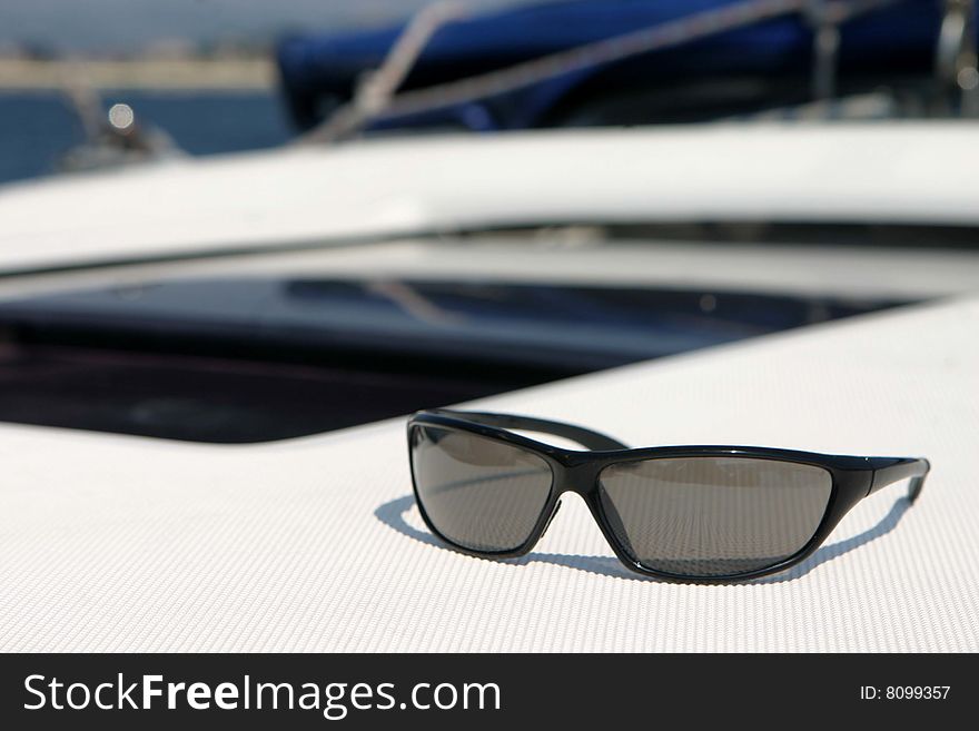 Sunglasses on sailing boat deck during cruise in Croatia