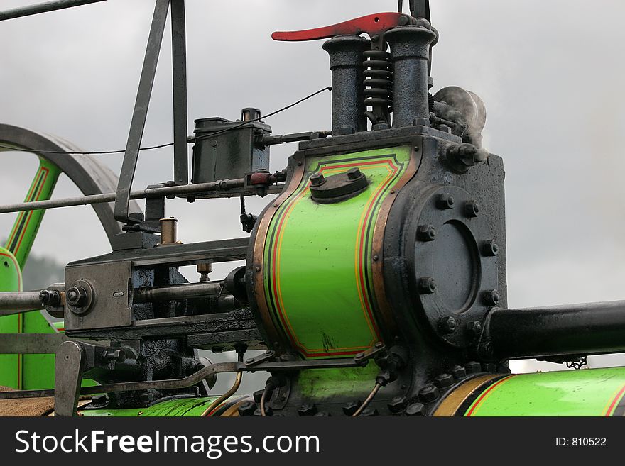 Detail shot of working traction engine showing to of cylinder casing and part of the rod/slid assembly. Detail shot of working traction engine showing to of cylinder casing and part of the rod/slid assembly.