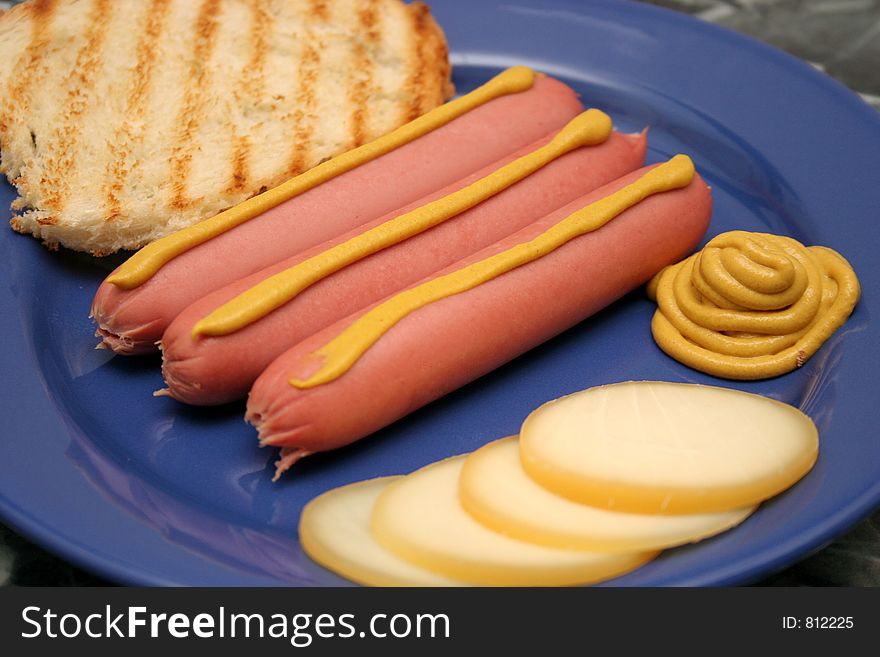Hot dog with mustard, toast and cheese