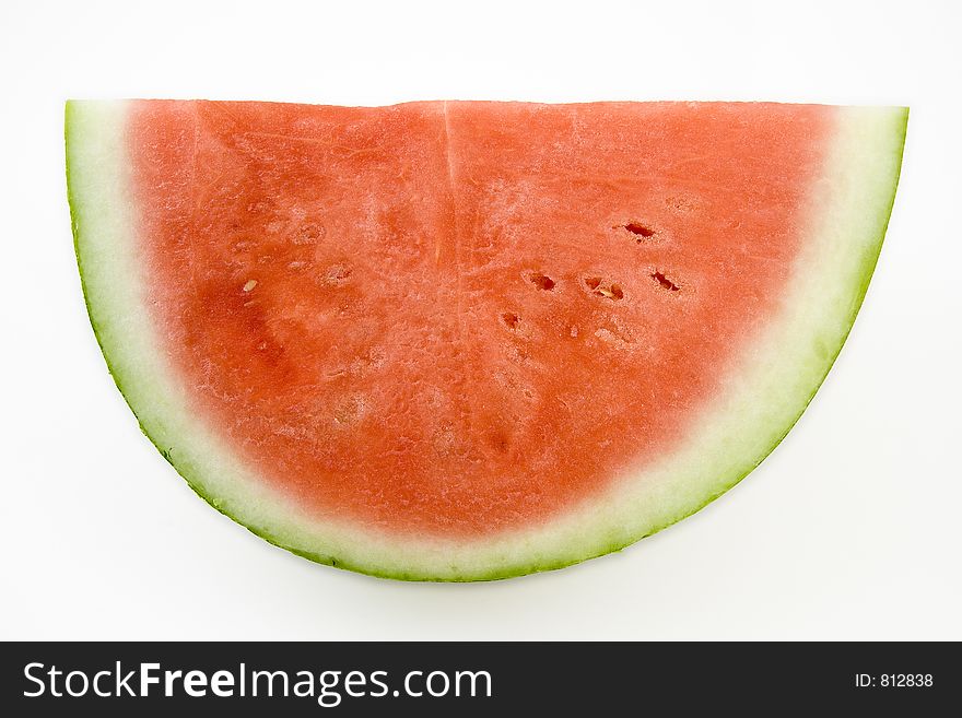 Quarter of a large seedless watermelon. On white background with embedded clipping path. Quarter of a large seedless watermelon. On white background with embedded clipping path.