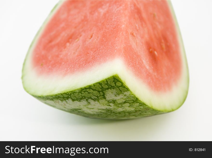 Quarter of a large seedless watermelon. On white background with embedded clipping path. Quarter of a large seedless watermelon. On white background with embedded clipping path.