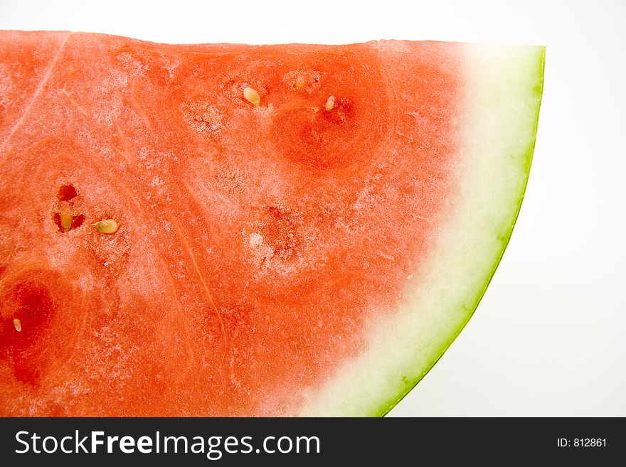 Quarter of a large seedless watermelon. On white background with embedded clipping path. Extremely sharp!. Quarter of a large seedless watermelon. On white background with embedded clipping path. Extremely sharp!