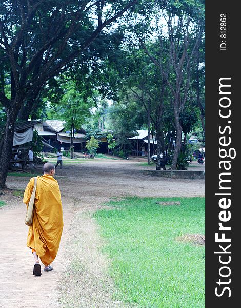 A monk returning to his temple, Thailand.