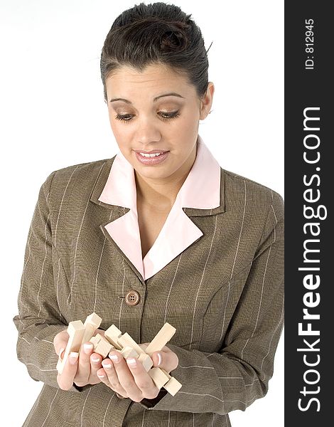 Woman with frustrated expression and hand full of wooden puzzle pieces. Woman with frustrated expression and hand full of wooden puzzle pieces.