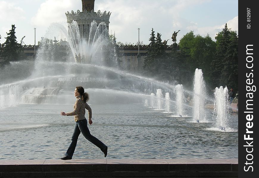 Running girl at fountain