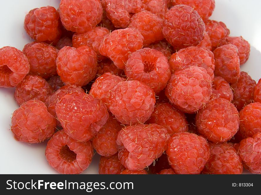 Raspberries In White Bowl