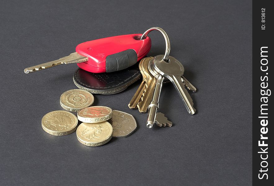 Car and house keys and coins