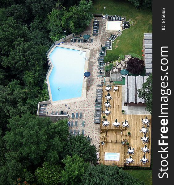 A pool and patio seen from above. A pool and patio seen from above