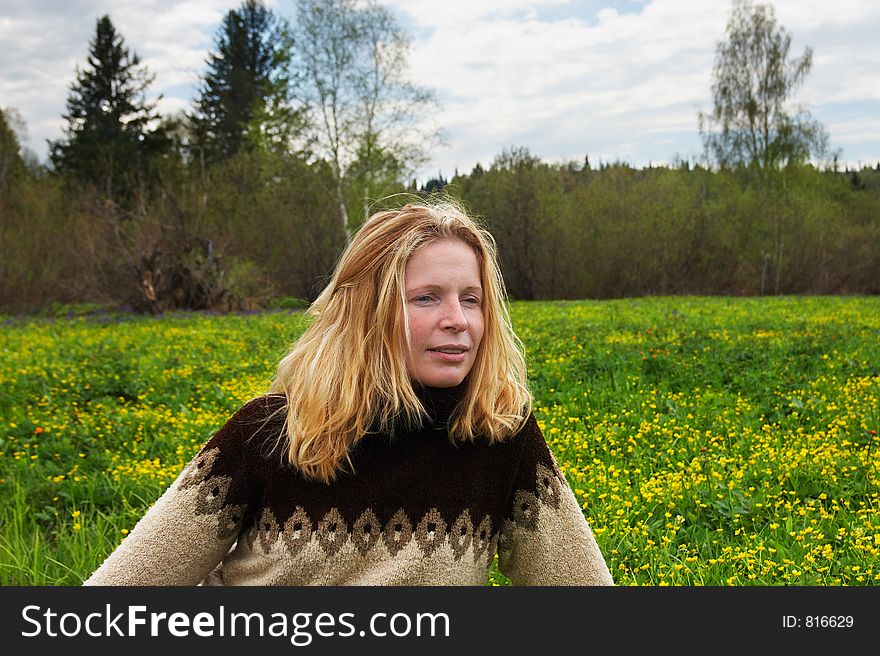 Woman on green field. Sibir. Russia.