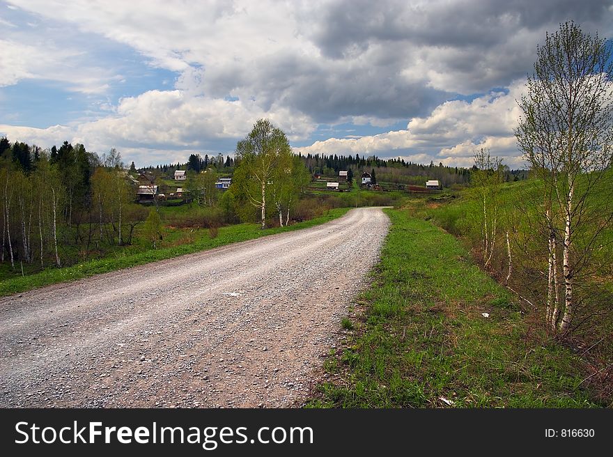 Country road and blue sky. Sibir. Russia.