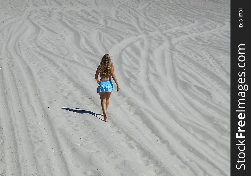 A girl walking on the beach. A girl walking on the beach