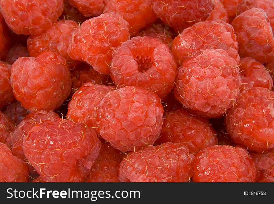 Macro photograph of ripe juicy raspberries. Macro photograph of ripe juicy raspberries.