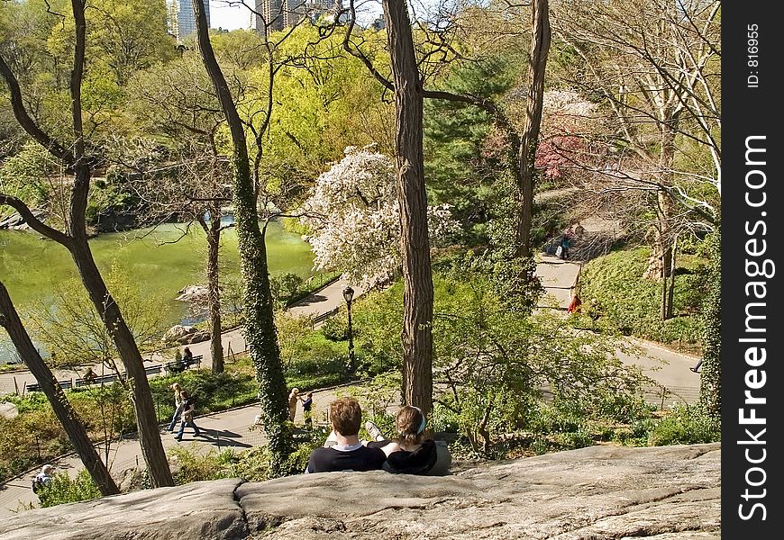 Some people resting on the rocks in Central Park in Manhattan. Some people resting on the rocks in Central Park in Manhattan.