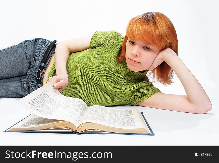 Young girl read the book on white