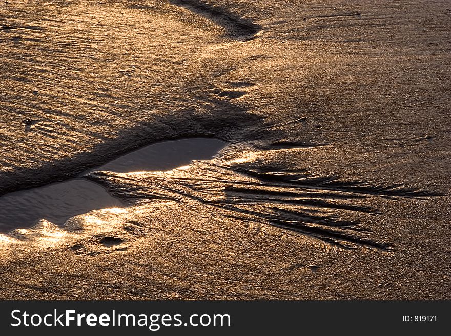 Sand forms created by the tide on a beach. Sand forms created by the tide on a beach