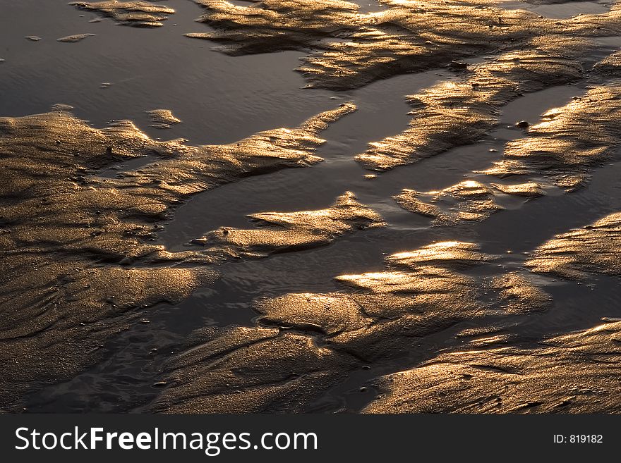 Sand forms created by the tide on a beach. Sand forms created by the tide on a beach