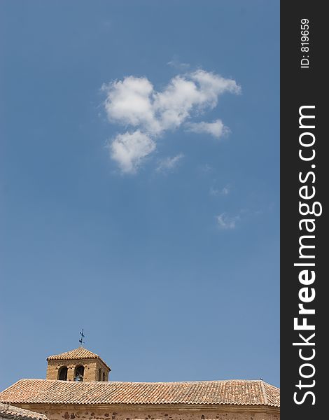Spanish roman church with clouds in the sky
