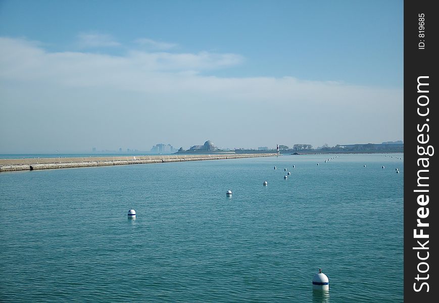 View of a city on water across the harbor. View of a city on water across the harbor