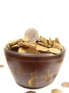 Coins In Ancient Bowl Royalty Free Stock Photos