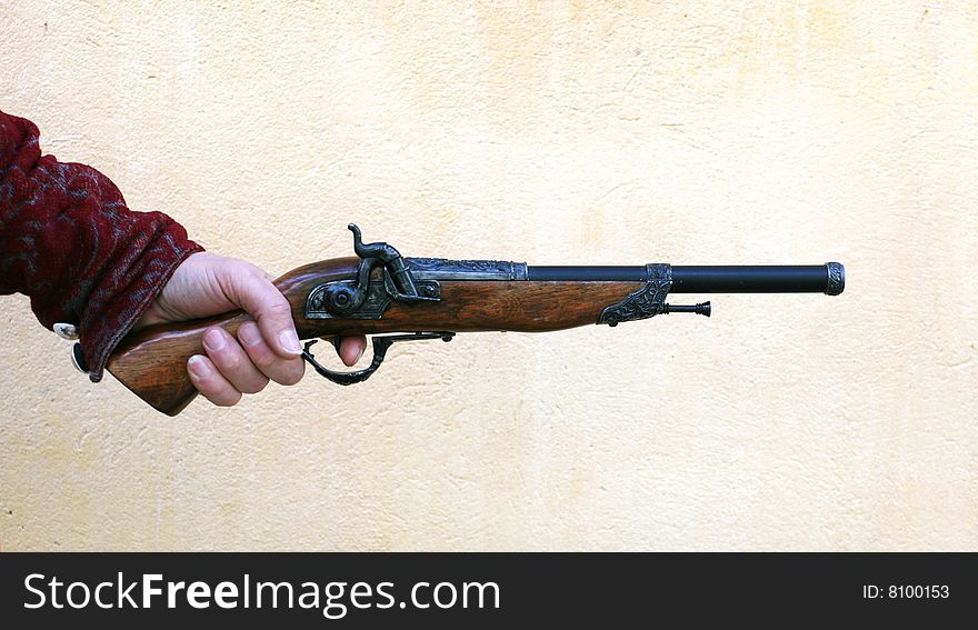 Male hand with old-fashioned handgun. Male hand with old-fashioned handgun