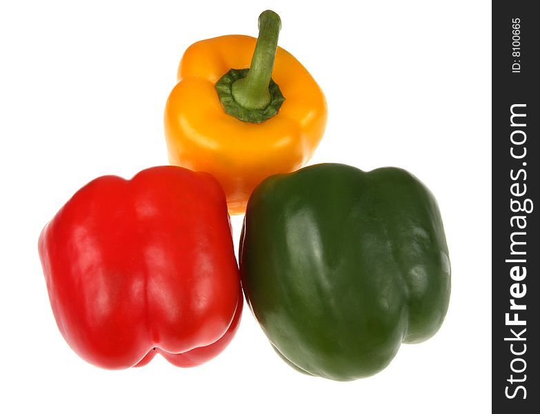 Three colourful peppers isolated on white