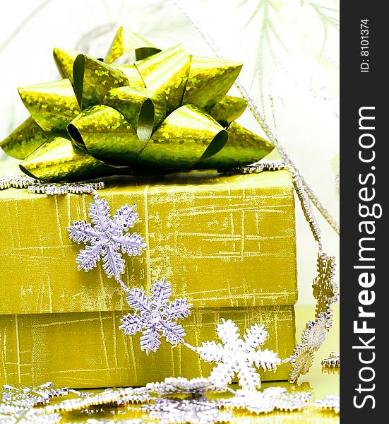 Yellow gift box with snowflakes