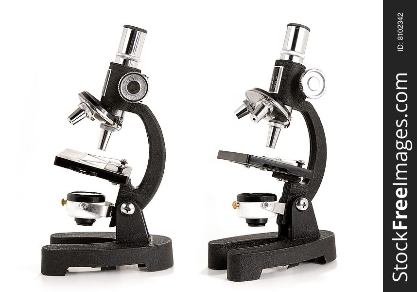 Two views of a microscope, isolated on white background