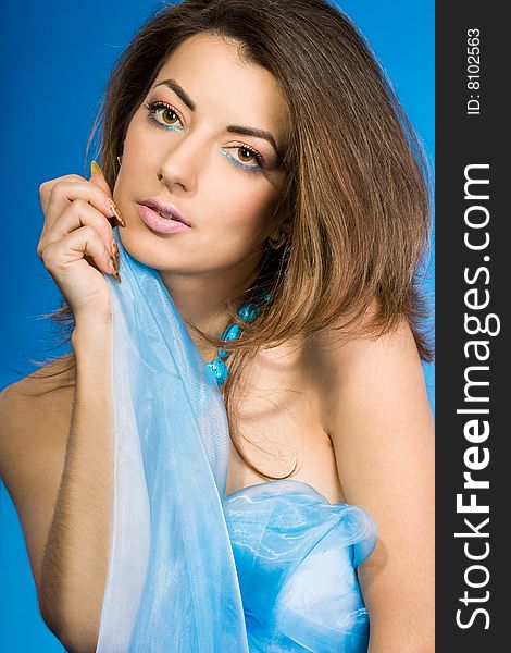 Beautiful woman with blue silk