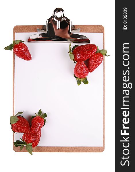 Strawberries on clipboard, healthy snack concept, isolated on white