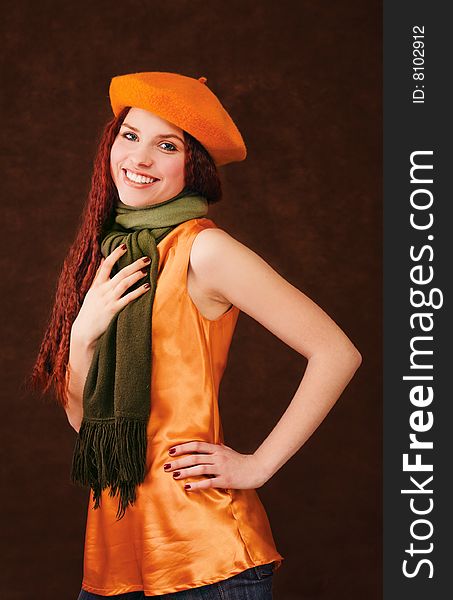 Young smiling girl in orange beret