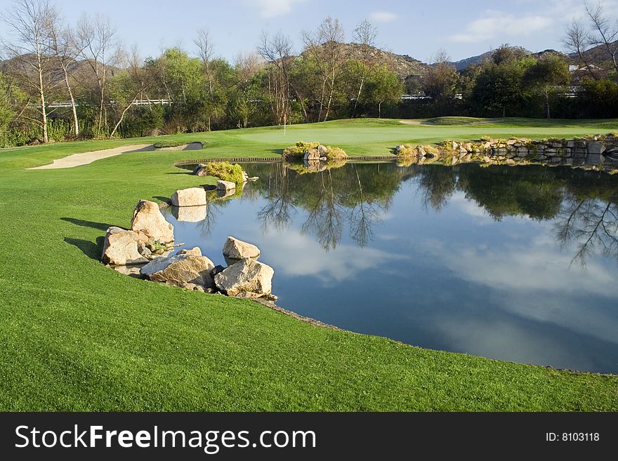 Golf Green and Lake on a Beautiful Morning.