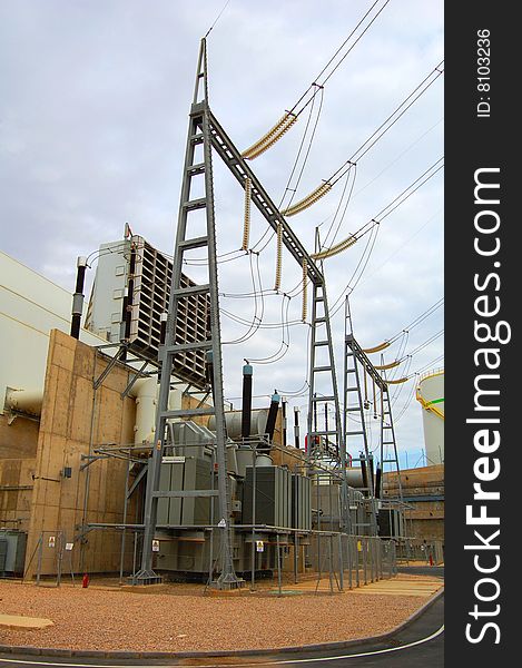 Power transformer at a Combine Cycle Power Plant. The gas turbine intake filter can be seen above the transformer. Power transformer at a Combine Cycle Power Plant. The gas turbine intake filter can be seen above the transformer.