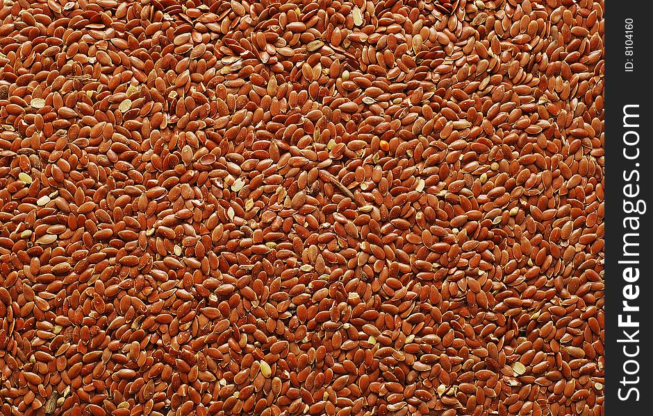 Brown flax seeds background texture