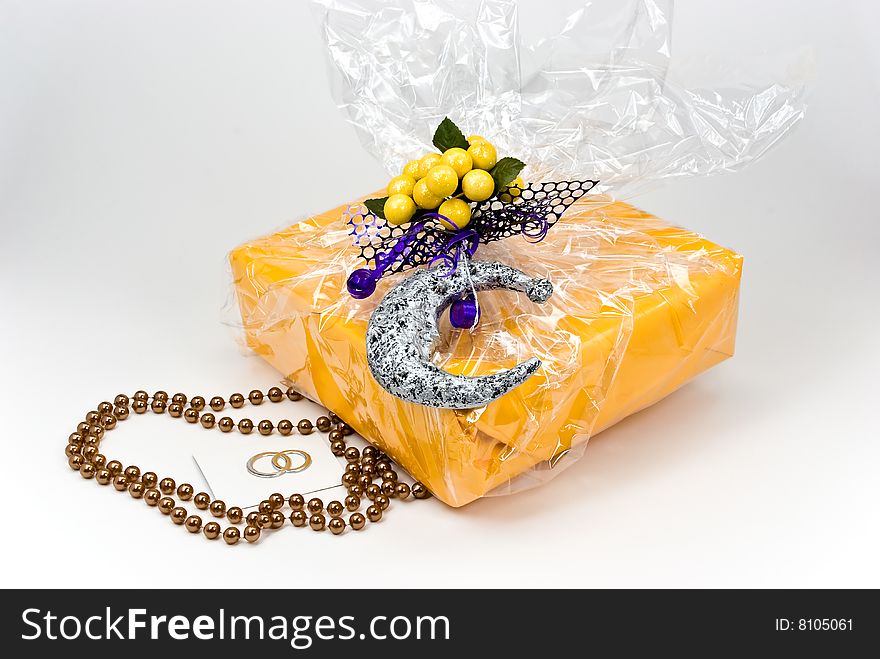 Gift box with pearls decoration and figurine lemons.