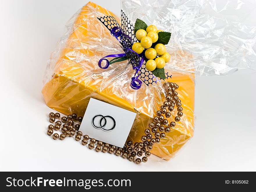 Gift box with pearls decoration and figurine lemons.