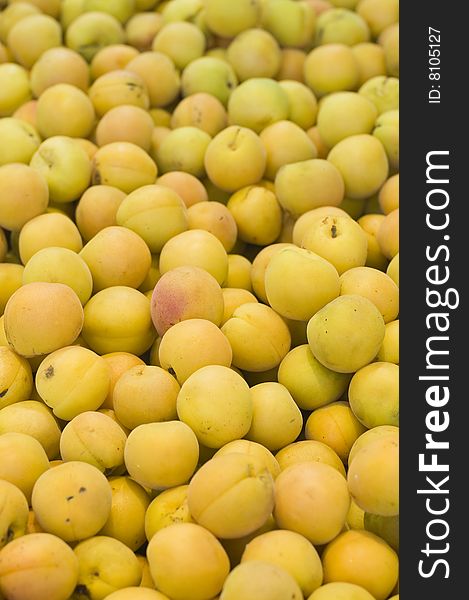 Many apricots displayed in fruit shop