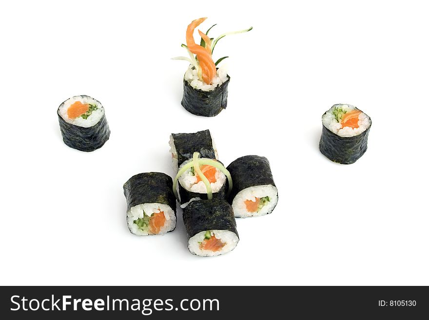 Sushi rolls with salmon and cucumber are isolated on the white background
