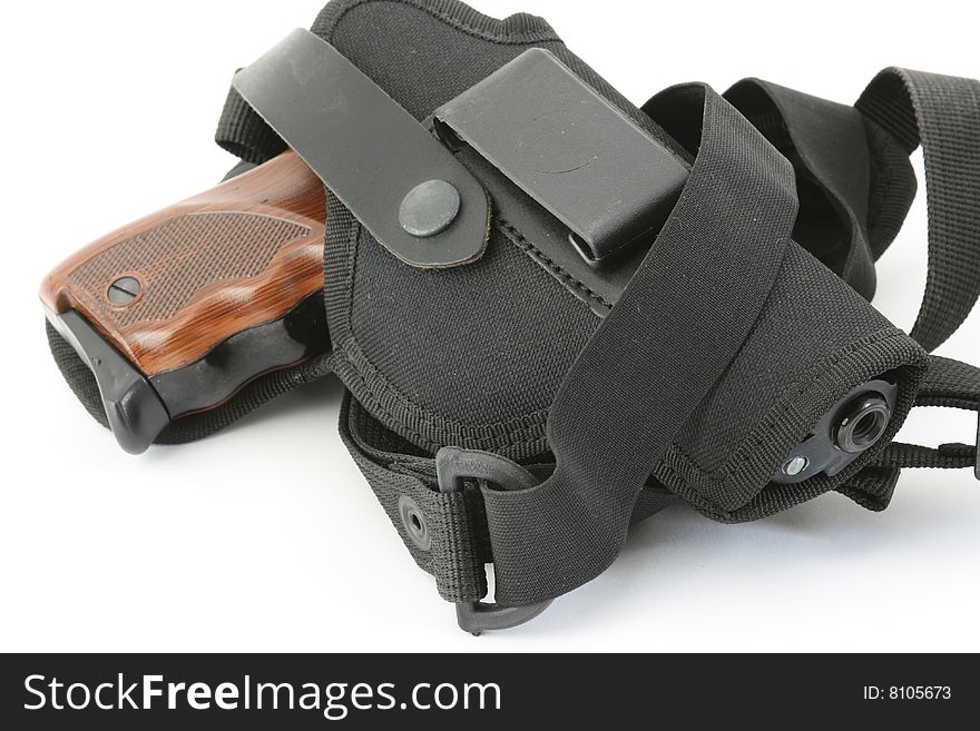 Pistol and holster on white background