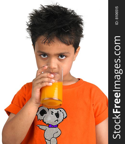 Boy drinking a glass of juic