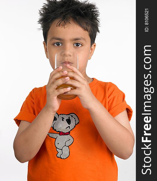 Boy Drinking A Glass Of Juic