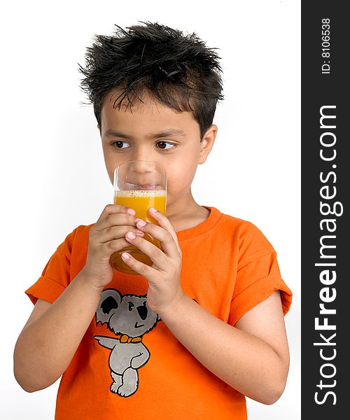 Asian boy drinking a glass of juice