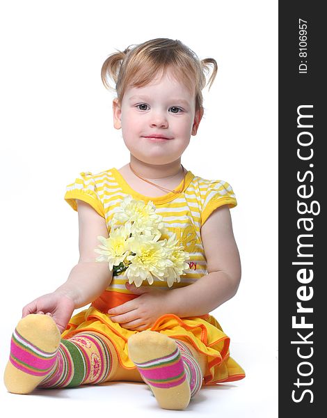 Funny little girl relaxing with yellow flowers. Funny little girl relaxing with yellow flowers