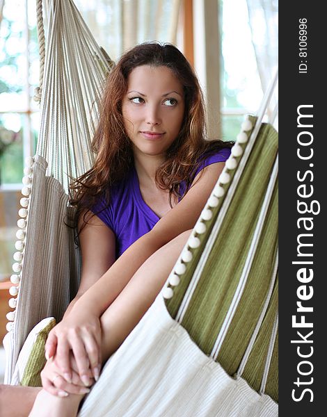 Beautyful long-haired girl relaxing in hammock. Beautyful long-haired girl relaxing in hammock