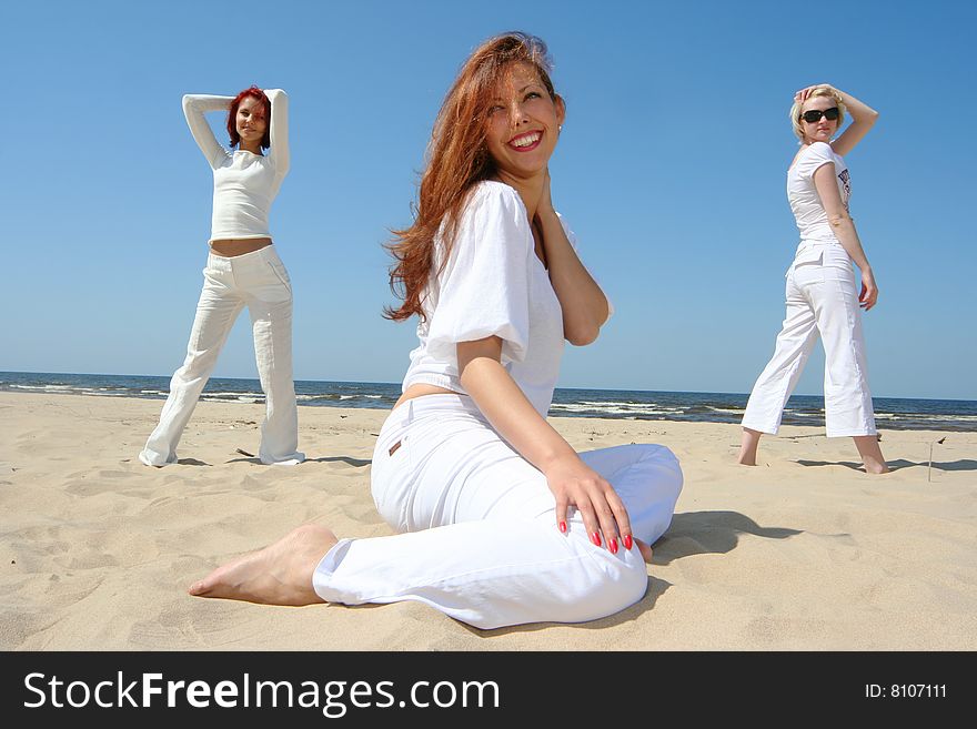 Three cute girls relaxing on the beach. Three cute girls relaxing on the beach