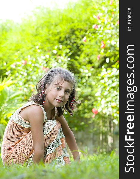 Portrait of little girl having good time in summer environment