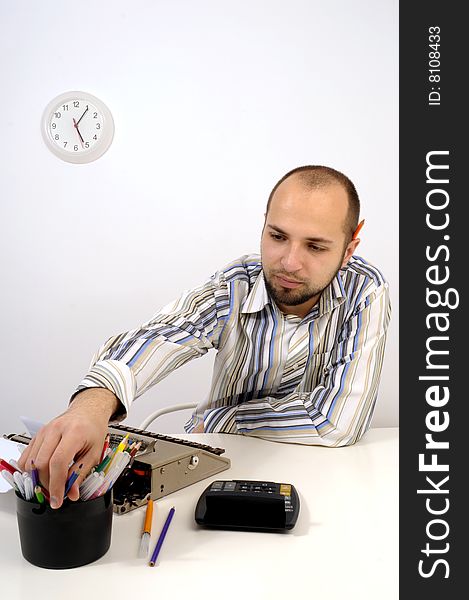 Man typing a document on an antique typewriter in an office. Man typing a document on an antique typewriter in an office