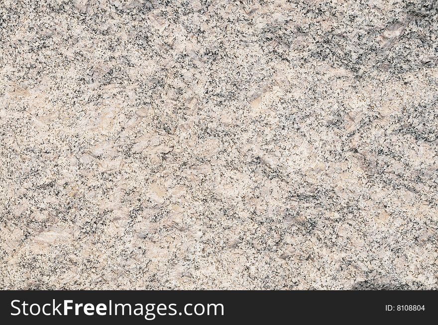 The rough and hard granite stone background. The rough and hard granite stone background.